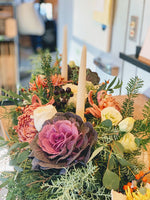 Gorgeous thanksgiving centerpiece made of local flowers from Rhode Island in a low and lush style with candles